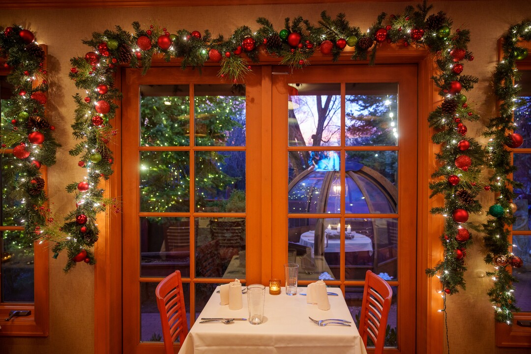 (Trent Nelson  |  The Salt Lake Tribune) Christmas decorations at Franck's Restaurant in Holladay on Saturday, Dec. 4, 2021. Outside the restaurant is an Alpenglobe, a dining shelter.
