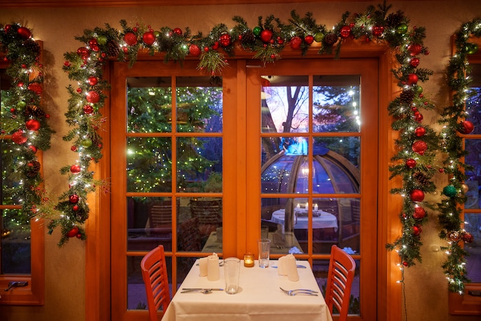 (Trent Nelson | The Salt Lake Tribune) Christmas decorations at Franck's Restaurant in Holladay on Saturday, Dec. 4, 2021. Outside the restaurant is an Alpenglobe, a dining shelter.