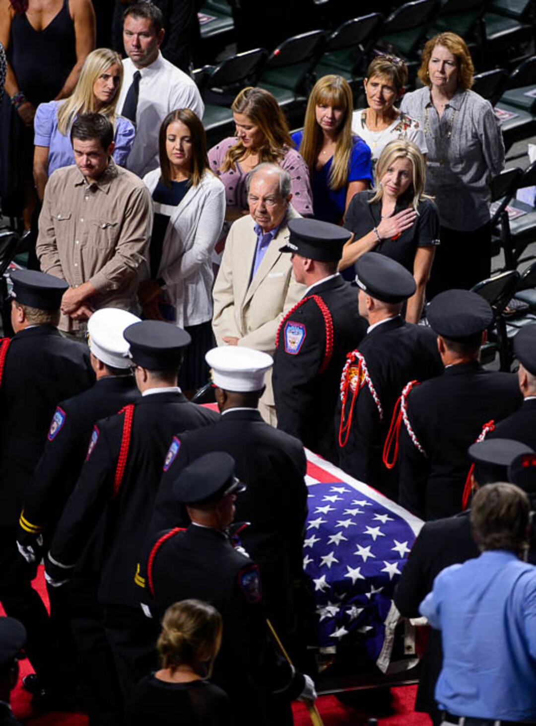 (Trent Nelson | The Salt Lake Tribune)  Funeral services for Battalion Chief Matthew Burchett at the Maverik Center in West Valley City, Monday Aug. 20, 2018.