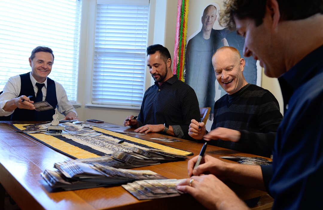 (Francisco Kjolseth  |  The Salt Lake Tribune)  The Piano Guys prepare for an upcoming show by signing CDs while gathered together at their home studio in Sandy recently.