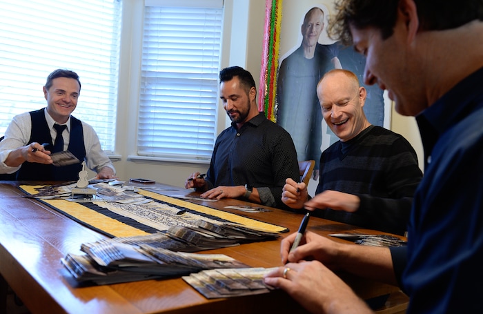 (Francisco Kjolseth | The Salt Lake Tribune) The Piano Guys prepare for an upcoming show by signing CDs while gathered together at their home studio in Sandy recently.