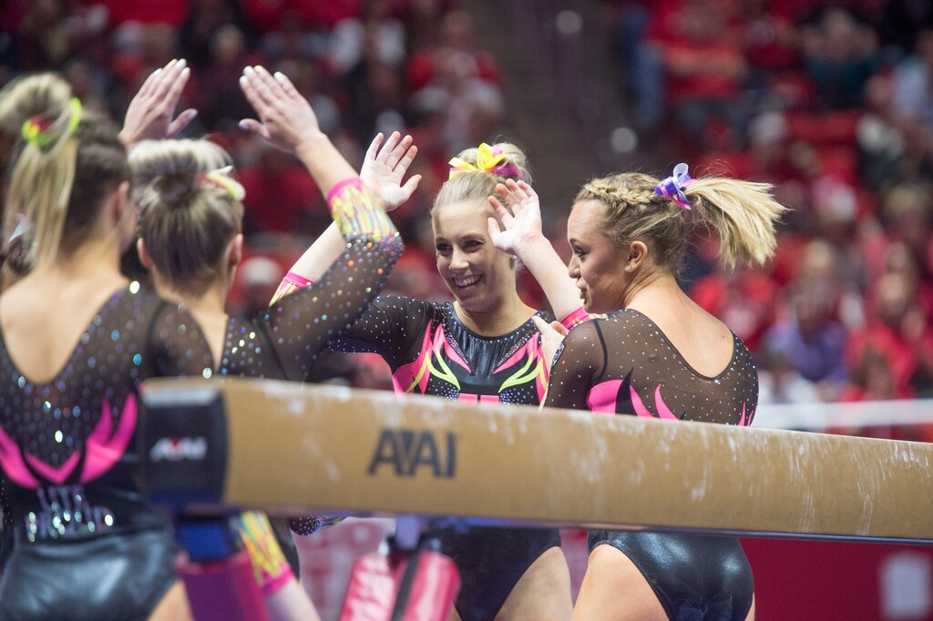 (Rick Egan  |  The Salt Lake Tribune)   Team mates congratulate MaKenna Merrell-Giles after her performance on the beam for Utah, in Gymnastics action Utah vs. Oregon State at the Jon M. Huntsman Center, Friday, January 19, 2018.