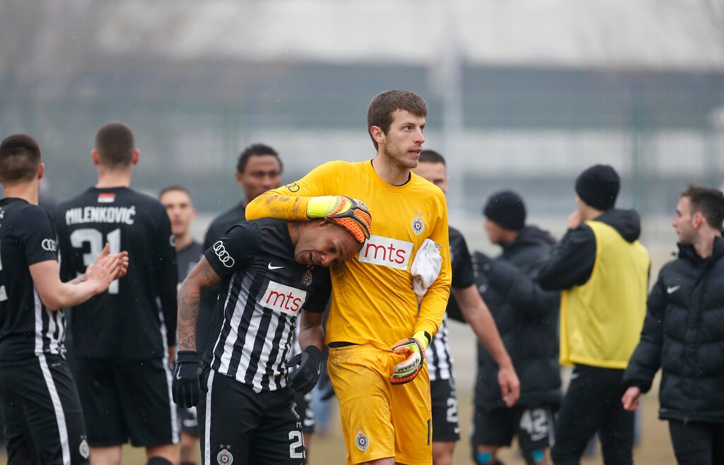 Partizan Belgrade's Brazilian player Everton Luiz, centre left, leaves the field accompanying by goalkeeper Filip Kljajic, during a Serbian championship match between Rad and Partizan, in Belgrade, Serbia, Sunday, Feb. 19, 2017. Luiz was in tears after suffering persistent racist chants during his team's 1-0 victory against Rad in the Serbian premiership. The Brazilian, who joined Partizan from the Swiss league in 2016, received monkey chants and other abuse, including a racist banner on the stands where Rad fans were standing. (AP Photo/Miroslav Todorovic)