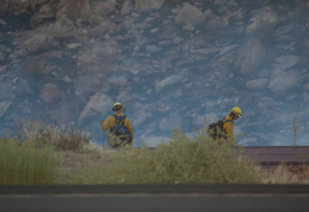 (Chris Caldwell | The Spectrum via AP) Fire crews from around Washington County fight a wildfire near Leeds, Utah. Sunday, July 19, 2020.