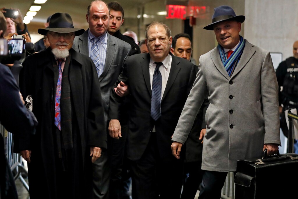 (Richard Drew | AP) Harvey Weinstein, center, accompanied by attorney Arthur Aidala, right, arrives at court for his rape trial, in New York, Wednesday, Jan. 22, 2020.