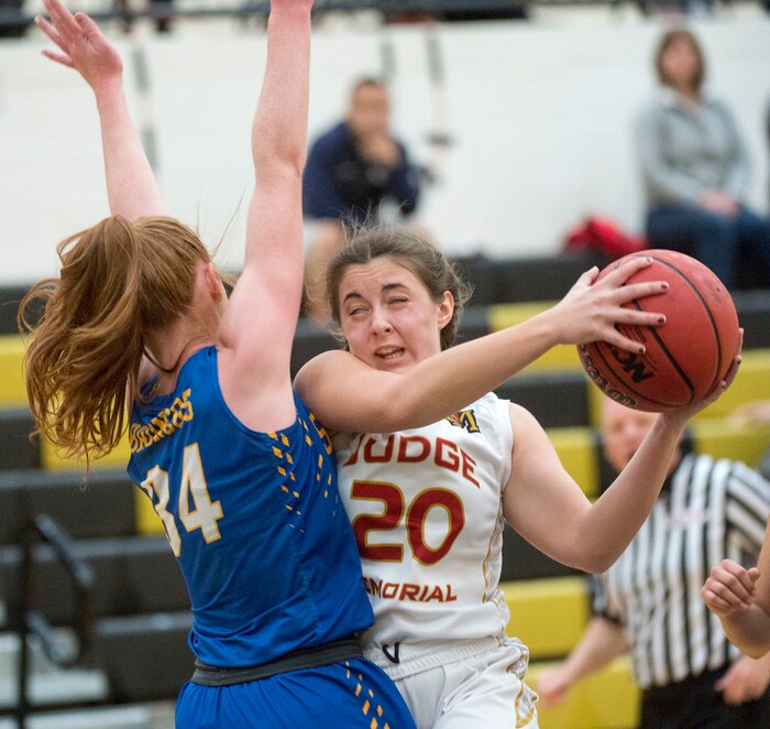 (Rick Egan  |  The Salt Lake Tribune)    San Juan forward, Delaney Palmer, (34) defends as Abbey Storms (20), Judge Memorial takes the ball up the middle, in 3A Women's basketball playoff action Judge Memorial Vs. San Juan, in Heber City, Friday, Feb. 16, 2018.