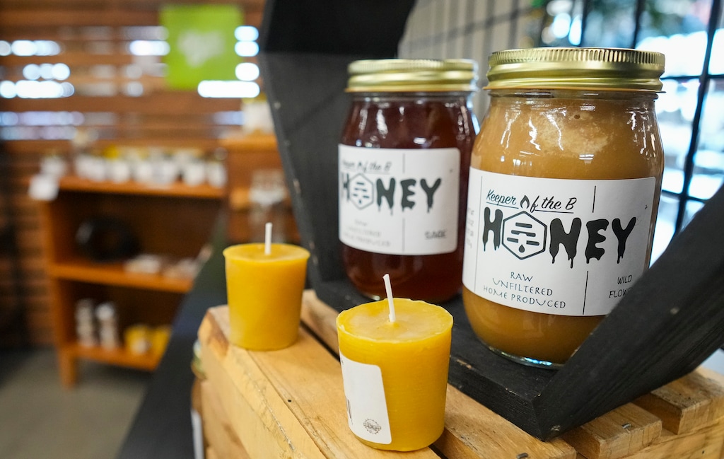 (Bethany Baker | The Salt Lake Tribune) Local honey from Keeper of the B sits on display at the Utah's Own Holiday Shoppes at Millcreek Common in Millcreek on Thursday, Dec. 5, 2024.