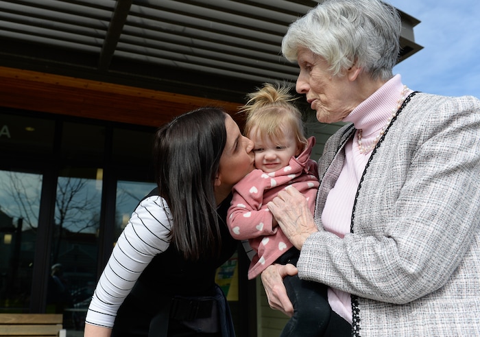 (Francisco Kjolseth | The Salt Lake Tribune) Eva May Densley, 1, carried by her mother Michelle, calls out "grandma" after catching a glimpse of champion for the homeless Pamela Atkinson while touring the YWCA Center for Women & Familes in Salt Lake on Tuesday, March 20, 2018. Michelle, a mother of three who lived out of her car and peoples homes for a time feels blessed to have landed an apartment at the women's center after experiencing violent abuse from her former husband during her pregnancy with Eva. Atkinson is encouraging people to donate to the Pamela Atkinson Homeless Trust Fund through their tax forms.