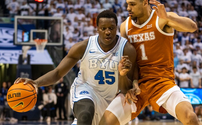 (Rick Egan | The Salt Lake Tribune) Brigham Young Cougars forward Fousseyni Traore (45) takes the ball inside, as Texas Longhorns forward Dylan Disu (1) defends, in basketball action between the Brigham Young Cougars and the Texas Longhorns, at the Marriott Center, on Saturday, Jan. 27, 2024.
