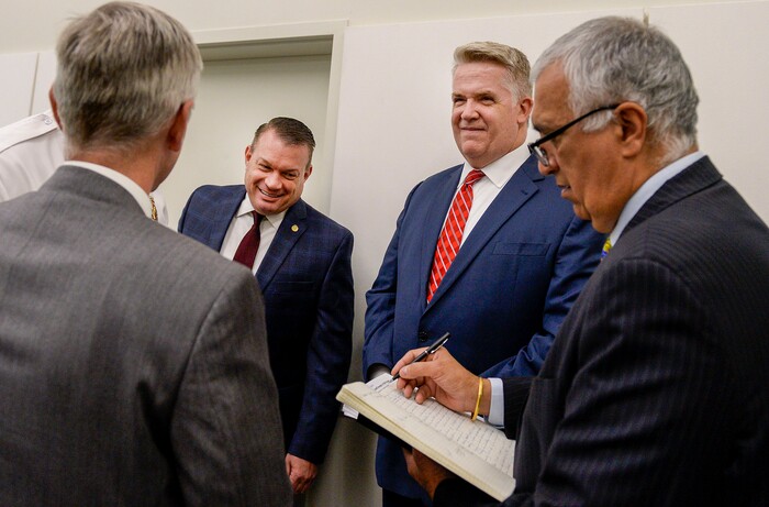 (Leah Hogsten | The Salt Lake Tribune) Utah FBI Special Agent in Charge Paul Haertel, Department of Public Safety Deputy Commissioner Jimmy Higgs, U.S. Attorney John Huber and Salt Lake County District Attorney Sim Gill chat briefly prior to their joint FBI Child Exploitation Task Force press conference to warn Utahns of the "hypersexualized virtual world" and to report the task force' findings in the fight to prevent children from being lured by internet predators and raped, kidnapped or murdered, Nov. 19, 2019. The multi-agency representatives reported that the task force netted 30 perpetrators in just four days in one month and called attention to the need for parents to police their children's online presence. "We expect you to step up and protect your children," said Gill. The five