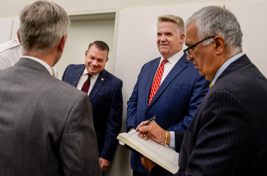 (Leah Hogsten | The Salt Lake Tribune) Utah FBI Special Agent in Charge Paul Haertel, Department of Public Safety Deputy Commissioner Jimmy Higgs, U.S. Attorney John Huber and Salt Lake County District Attorney Sim Gill chat briefly prior to their joint FBI Child Exploitation Task Force press conference.