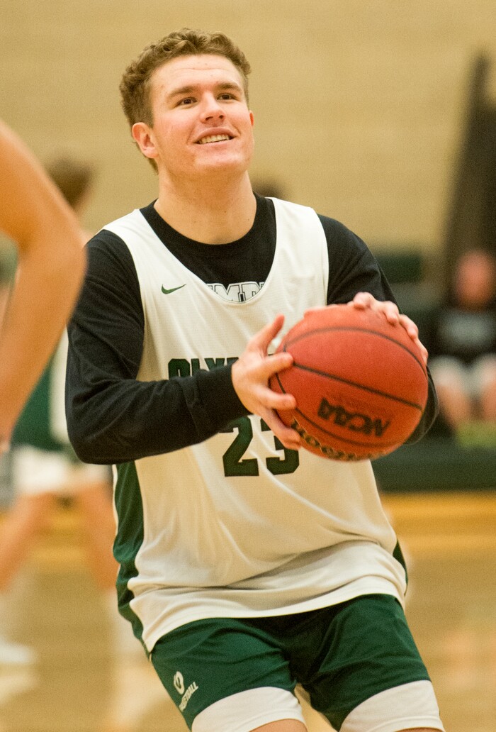 (Rick Egan  |  The Salt Lake Tribune)    Harrison Creer (23), one of Olympus boys' basketball team's two big men, runs drills during practice, Monday, January 8, 2018.