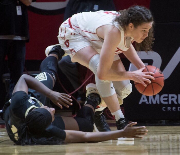 (Rick Egan  |  The Salt Lake Tribune)  Utah Utes center Megan Huff (5) steals the ball from Purdue Boilermakers guard Andreona Keys (10), in basketball action Utah Utes vs. Purdue Boilermakers, at the Jon M. Huntsman Center, Monday, Nov. 20, 2017.