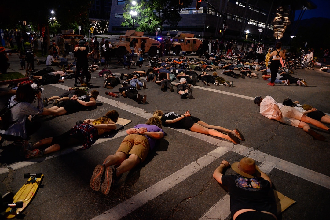 (Francisco Kjolseth  |  The Salt Lake Tribune)  Demonstrators protesting against police brutality lay down in silence in honor of George Floyd on on the street outside the Salt Lake City Public Safety Building on Wednesday, June 3, 2020.