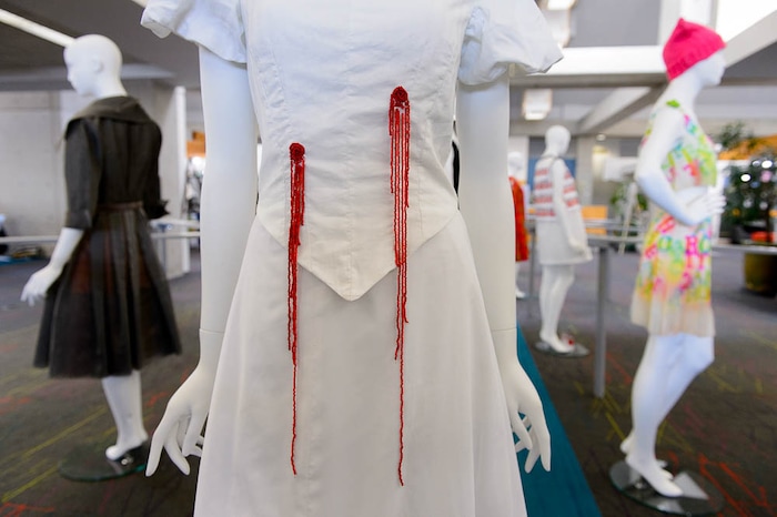 (Trent Nelson | The Salt Lake Tribune)  Janelle Aase's dress focusing on gun violence, which is part of "Dressed to Protest," a new exhibit presented by students in Salt Lake Community College's Fashion Institute, in Taylorsville, Thursday January 18, 2018. The exhibit shows how clothing can (and has) been used as a way for social and political protest. Most of the pieces are student designs, but a few come from the Fashion Institute's historic clothing collection.