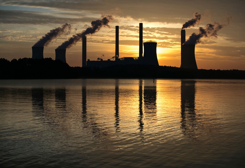 (Branden Camp | The Associated Press) In this June 3, 2017, file photo, the coal-fired Plant Scherer, one of the nation's top carbon dioxide emitters, stands in the distance in Juliette, Ga. The Trump administration intends to roll back the centerpiece of former President Barack Obama’s efforts to slow global warming, seeking to ease restrictions on greenhouse gas emissions from coal-fired power plants.