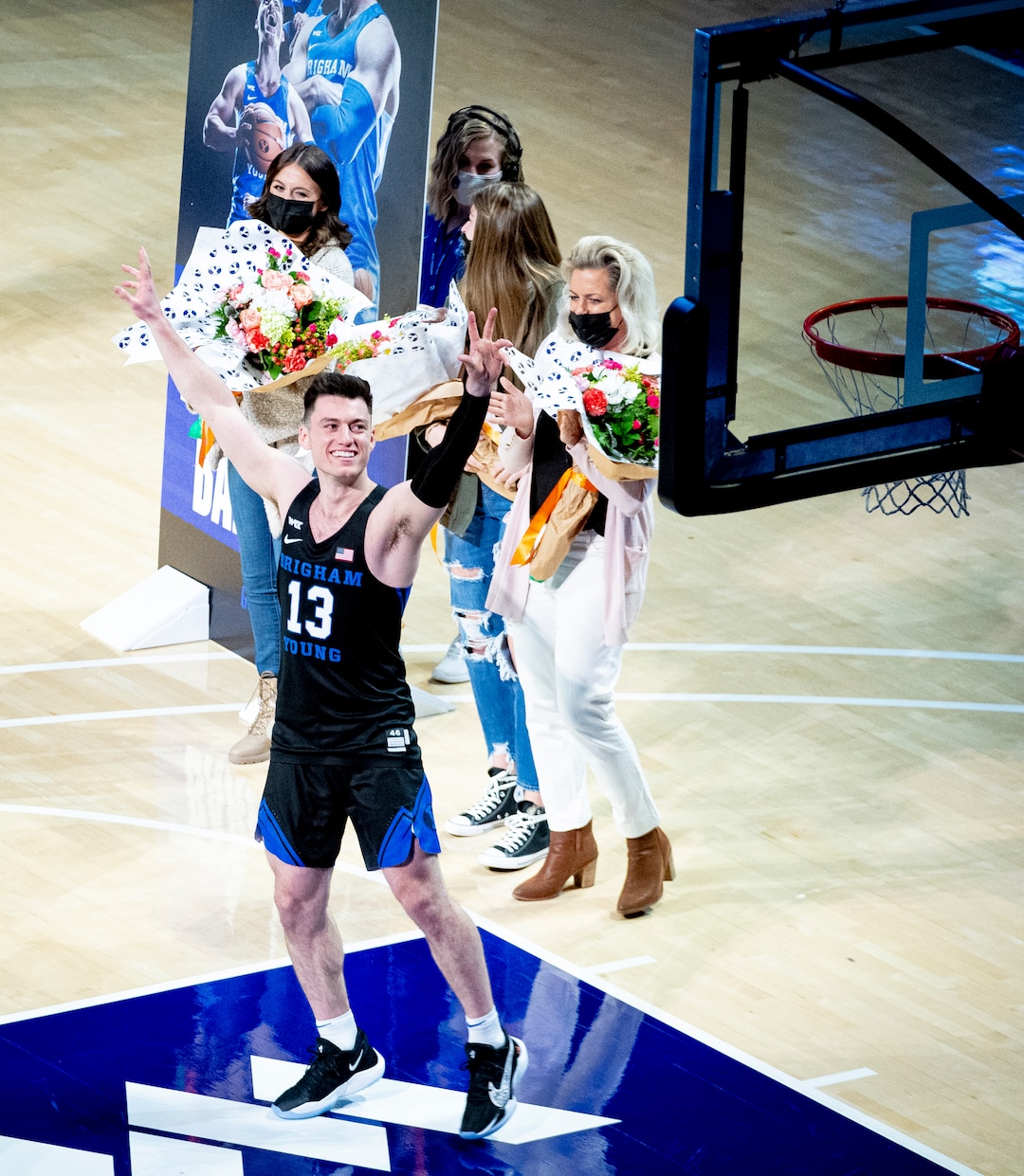 (Isaac Hale | Special to The Tribune) Brigham Young University guard Alex Barcello (13) greets the crowd as he is honored with other graduating seniors before a game between the BYU Cougars and the Saint Mary’s College of California Gaels held at the Marriott Center in Provo on Saturday, Feb. 27, 2021.