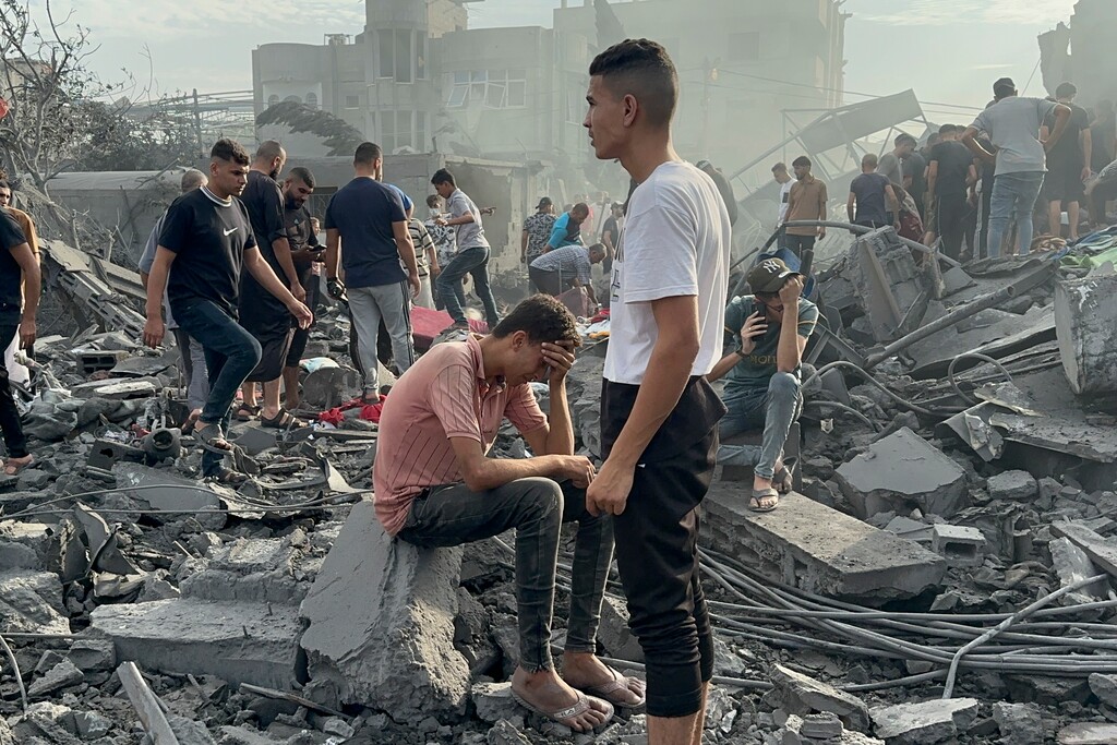 (Doaa AlBaz | AP) Palestinians look for survivors after an Israeli airstrike in a Gaza Strip refugee camp Tuesday, Oct. 31, 2023.
