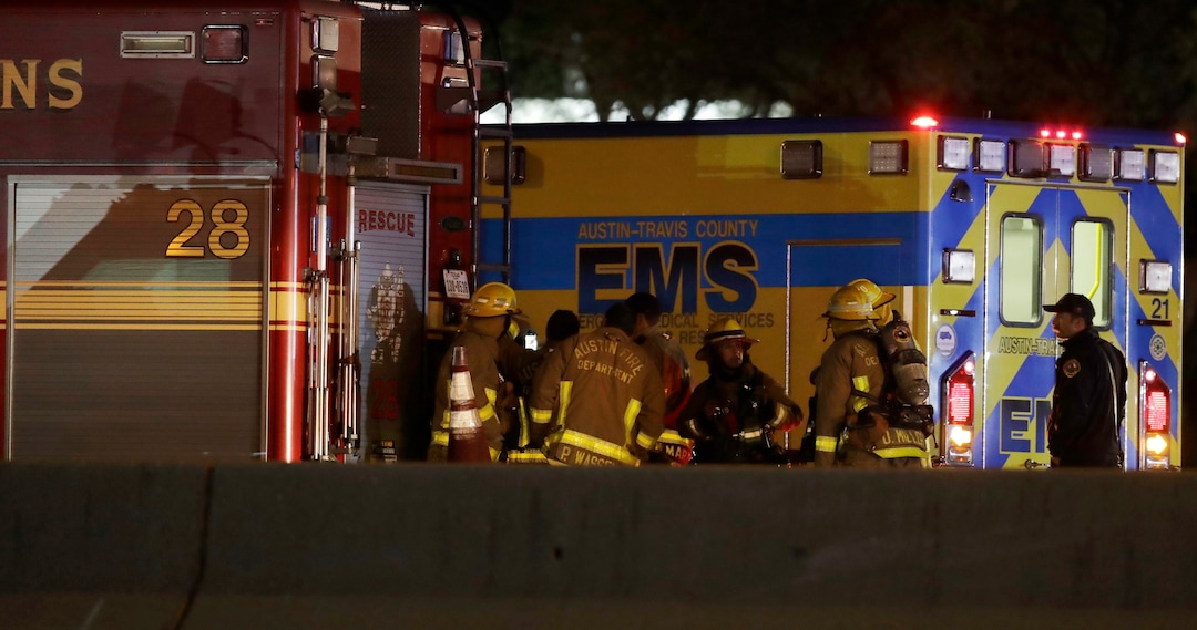 Firefighters stage near the area where a suspect in a series of bombing attacks in Austin blew himself up as authorities closed in, early Wednesday, March 21, 2018, in Round Rock, Texas. (AP Photo/Eric Gay)