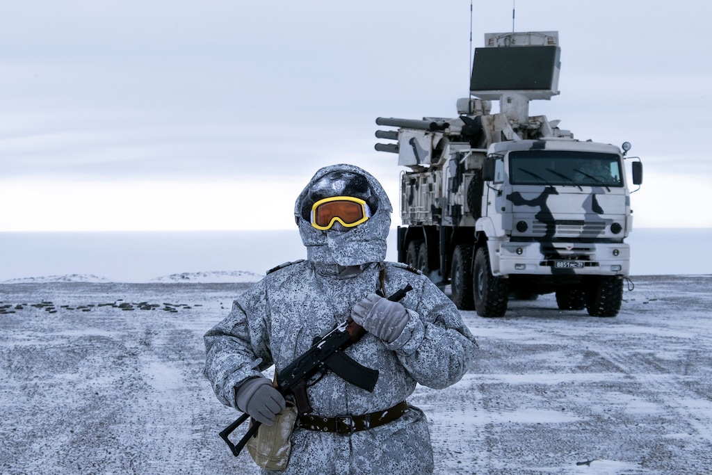 In this photo taken on Wednesday, April 3, 2019, a Russian solder stands guard as Pansyr-S1 air defense system on the Kotelny Island, part of the New Siberian Islands archipelago located between the Laptev Sea and the East Siberian Sea, Russia. Russia has made reaffirming its military presence in the Arctic the top priority amid an intensifying international rivalry over the region that is believed to hold up to one-quarter of the planet's undiscovered oil and gas. (AP Photo/Vladimir Isachenkov)
