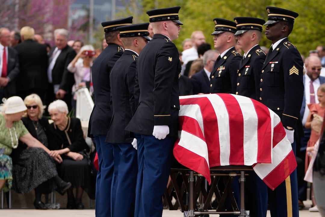 (Francisco Kjolseth | The Salt Lake Tribune) Family and friends of former U.S. Senator Orrin Hatch watch as final honors are performed by the Utah Army National Guard after the funeral at The Church of Jesus Christ of Latter-day Saints Institute of Religion in Salt Lake City on Friday, May 6, 2022. Hatch, the longest-serving Republican senator in U.S. history and the longest-serving from Utah, died April 23 at age 88.