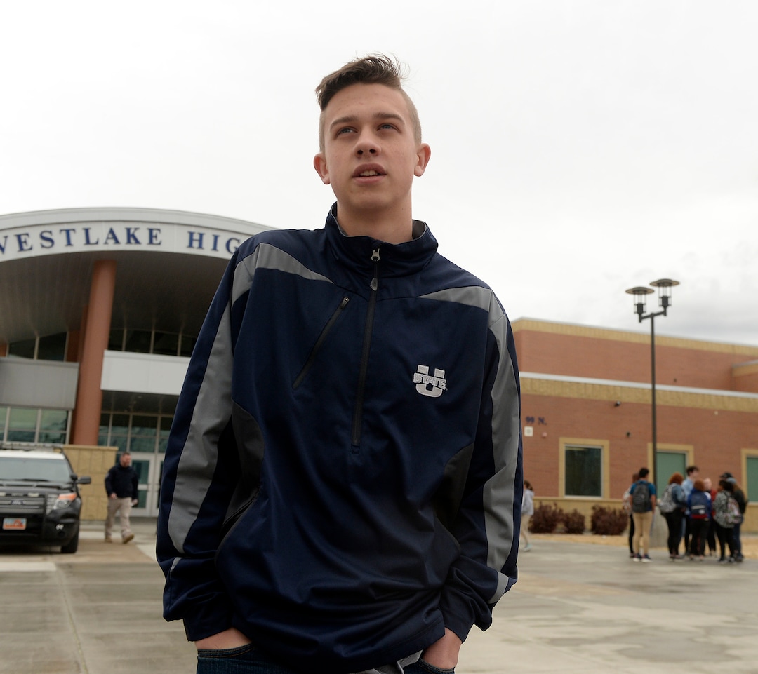 (Al Hartmann  |  The Salt Lake Tribune) 	Logan Storey, a junior speaks why he joined about 80 students at Westlake High School in Saratoga Springsthat  left class and stood together in silence at the front entrance of the school Wednesday March 14, 2018 to remember the 17 students who died in a school shooting in Florida.  They held posters of the names of those killed. 