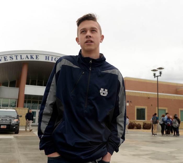 (Al Hartmann  |  The Salt Lake Tribune) 	
Logan Storey, a junior speaks why he joined about 80 students at Westlake High School in Saratoga Springsthat  left class and stood together in silence at the front entrance of the school Wednesday March 14, 2018 to remember the 17 students who died in a school shooting in Florida.  They held posters of the names of those killed. 