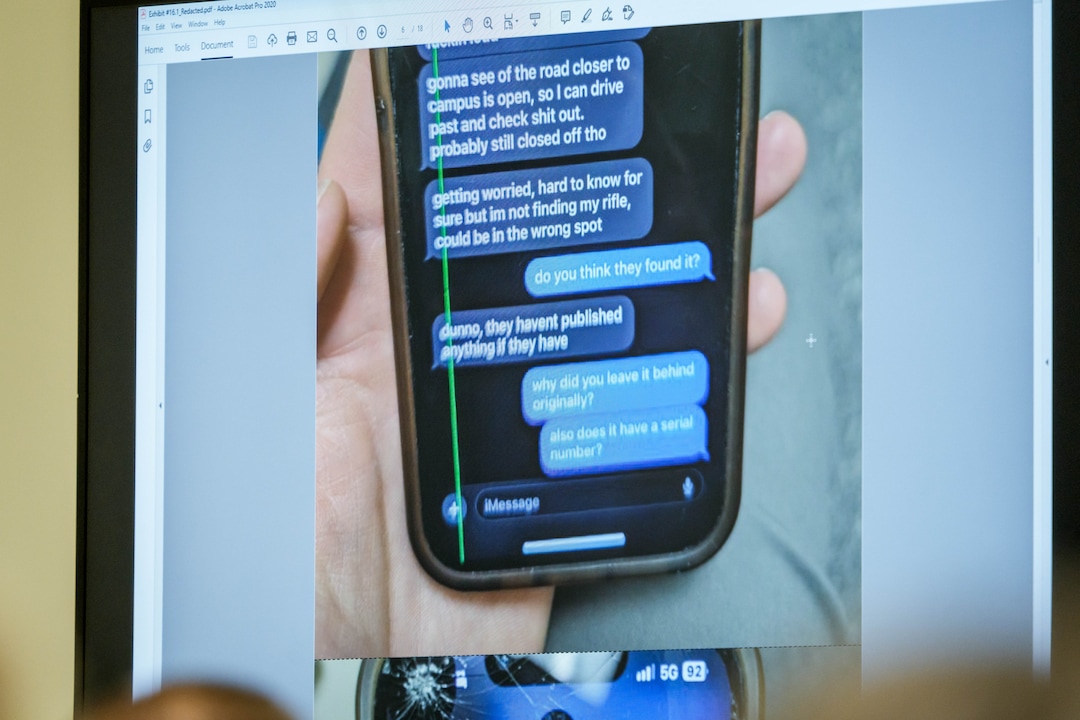 (Spenser Heaps | Pool) A photograph which prosecutors say shows a text message exchange between Tyler Robinson, who is accused in the fatal shooting of Charlie Kirk, and Robinson’s roommate and romantic partner Lance Twiggs, is shown during a preliminary hearing at the Fourth District Courthouse in Provo, Thursday, July 9, 2026.