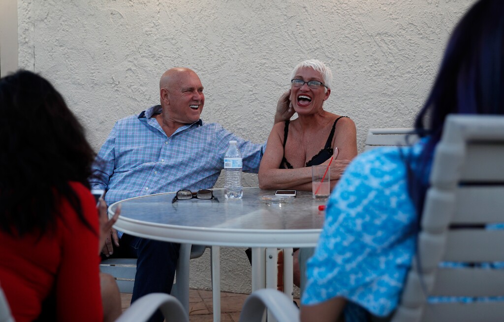 (John Locher | The Associated Press) In this April 27, 2018, photo, owner Dennis Hof, left, jokes with madam Sonja Bandolik at the Love Ranch brothel in Crystal, Nev. A coalition of religious groups and anti-sex trafficking activists have launched referendums to ban brothels in two of Nevada's seven counties where they legally operate. Hof, a legal pimp challenging an incumbent Republican lawmaker Tuesday, June 12, says a push to ban legal brothels is political retribution.