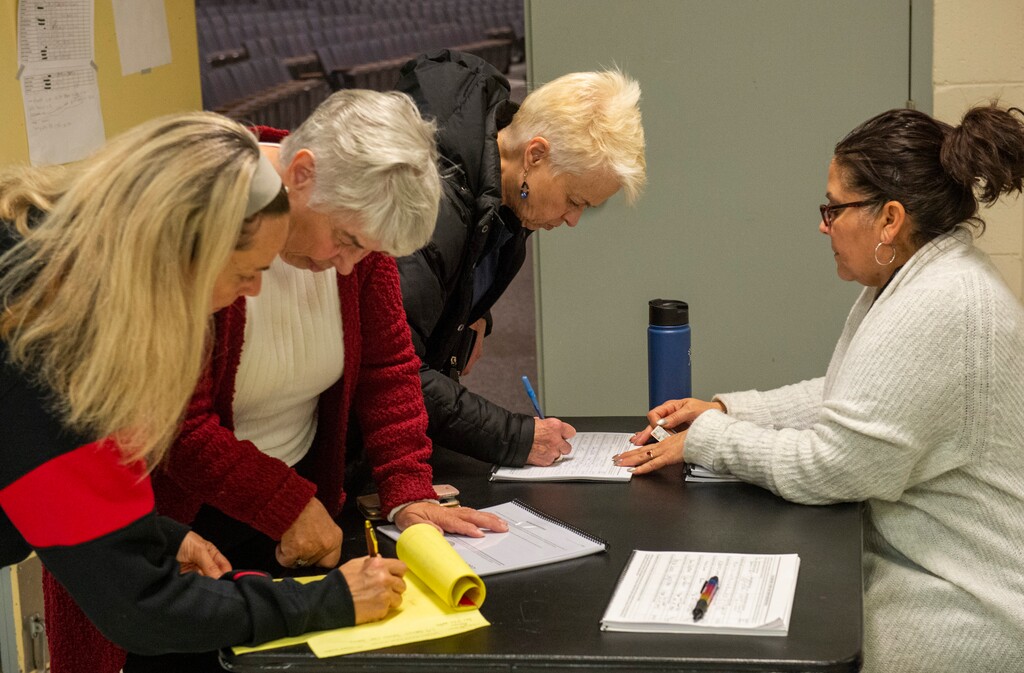 (Rick Egan | Tribune file photo)  Concerned citizens gather to sign the tax referendum during an event at West High School on Thursday, Jan. 9, 2020.