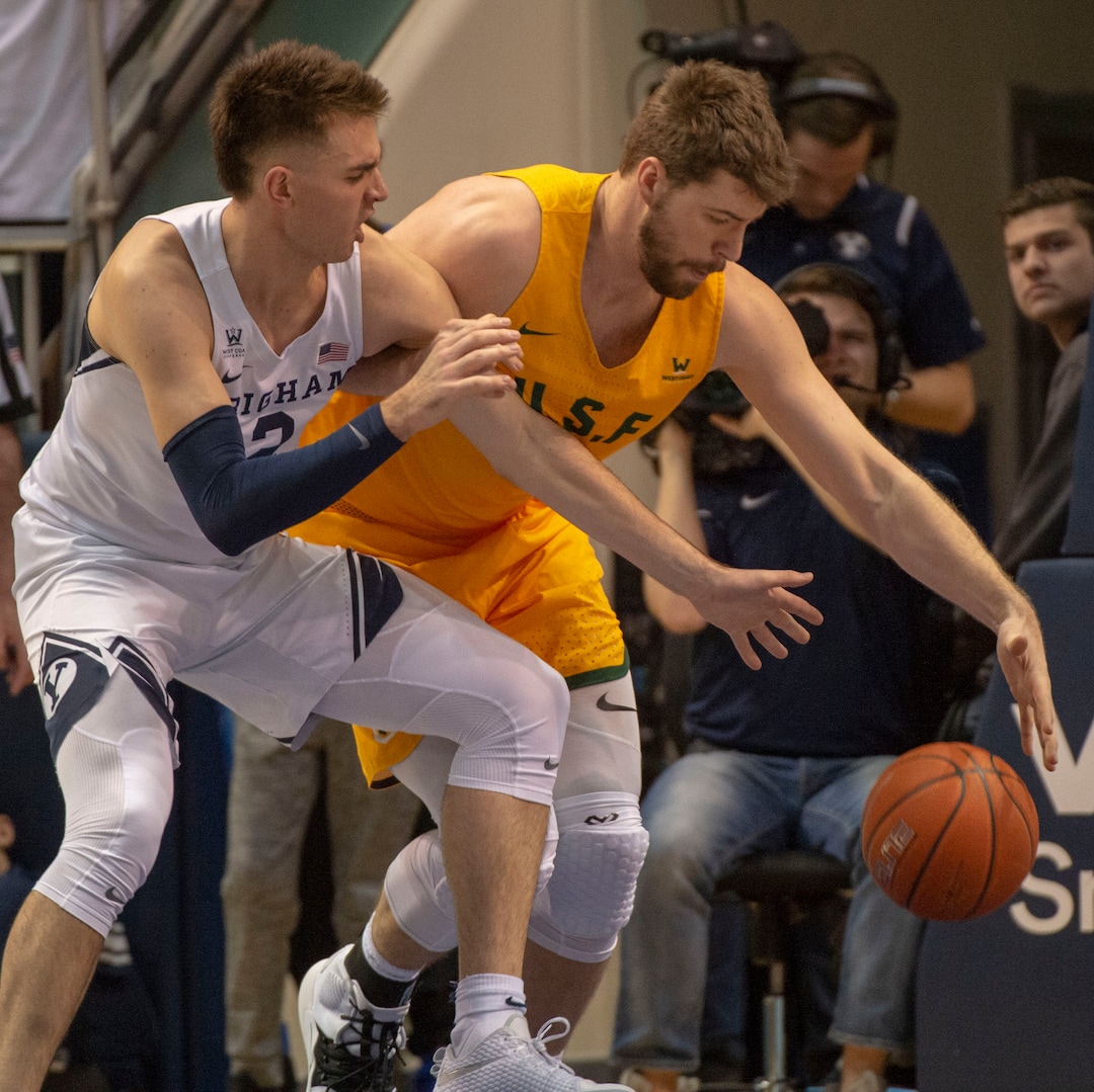 (Rick Egan  |  The Salt Lake Tribune)      Brigham Young Cougars guard Zac Seljaas (2) goes after a loose ball along with San Francisco Dons center Jimbo Lull (5), in WCC basketball action between Brigham Young Cougars and San Francisco Dons, at the Marriott  Center, Thursday, February 21, 2018.