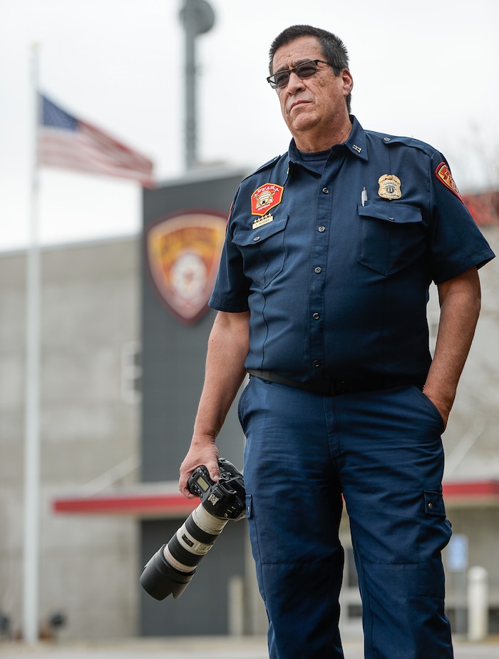 (Francisco Kjolseth  |  The Salt Lake Tribune)  Fitzgerald Petersen, a captain with Unified Fire Authority often has a front row seat to documenting his colleagues on the fire line. For the past 17 years he's been the department's photographer. In that capacity, he listens to his radio on his off days and responds to incidents to document his coworkers.