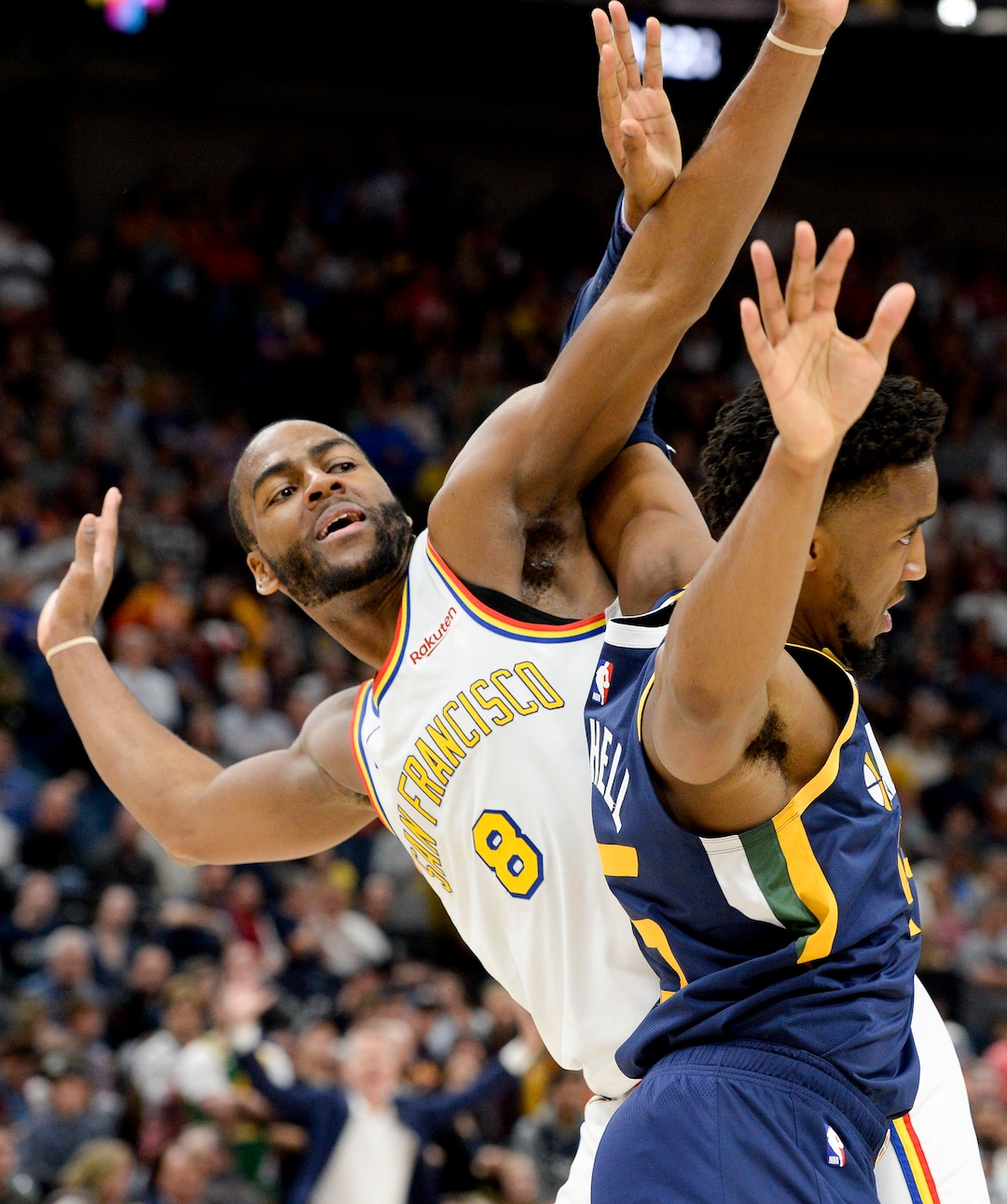 (Leah Hogsten  |  The Salt Lake Tribune) Golden State Warriors guard Alec Burks (8) tangles with Utah Jazz guard Donovan Mitchell (45)as the Utah Jazz defeated the Golden State Warriors, 114-106, Dec. 13, 2019 at Vivint Arena.