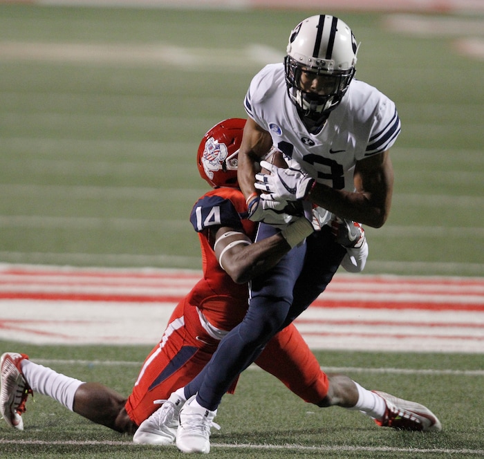 BYU's Micah Simon runs into Fresno State's Jaron Bryant during the second half of an NCAA college football game in Fresno, Calif., Saturday, Nov. 4, 2017. Fresno State won the game 20-13. (AP Photo/Gary Kazanjian)
