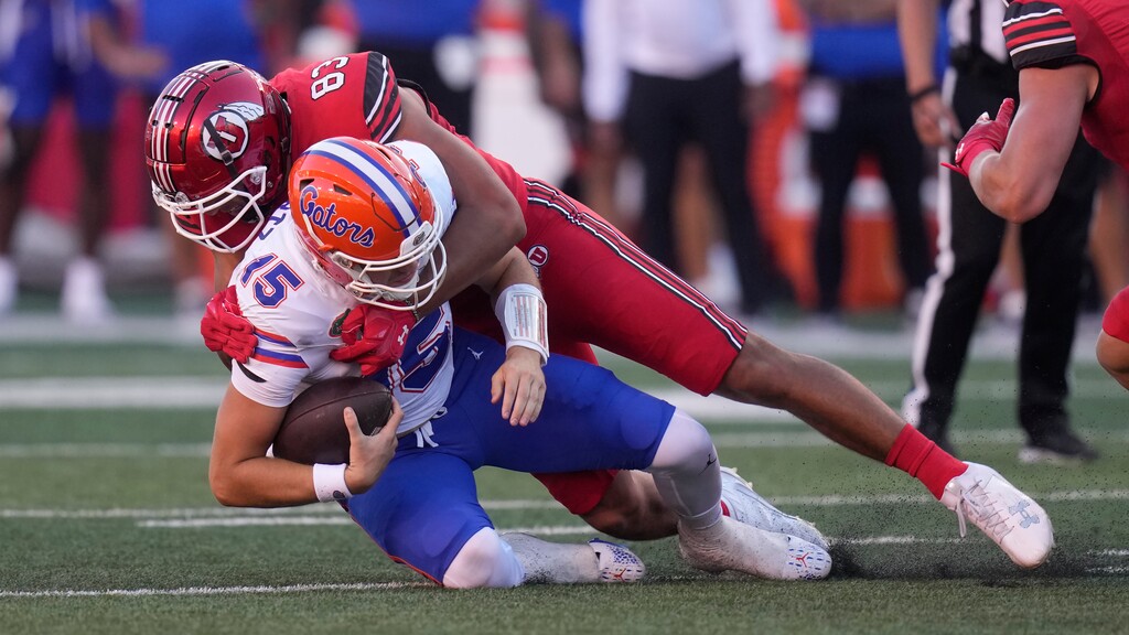 Utah defensive end Jonah Elliss (83) sacks Florida quarterback Graham Mertz (15) during the first half of an NCAA college football game Thursday, Aug. 31, 2023, in Salt Lake City. (AP Photo/Rick Bowmer)