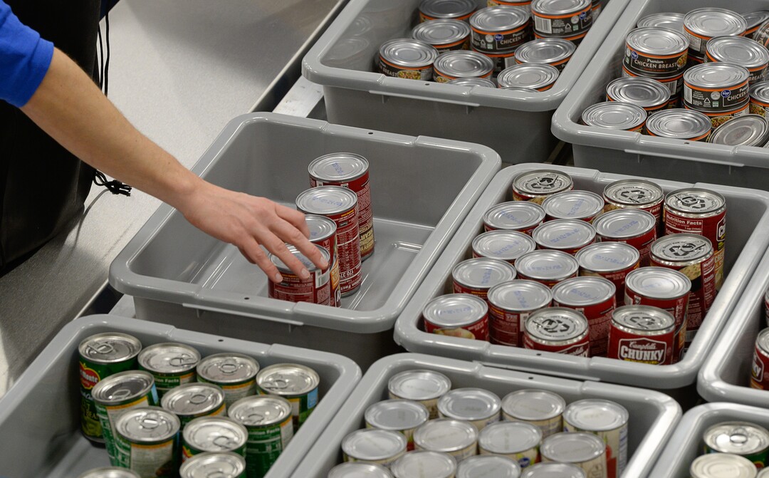 (Francisco Kjolseth  |  The Salt Lake Tribune)  USANA staff volunteer their time assembling food bags for at-risk youth at the newly-renovated packing and storage facility next to the headquarters of the Salt Lake City company on Wed. Dec. 11, 2019. The USANA Foundation has acquired two local charities, Kids Next Door and KidsEat!, that provides hundreds of food bags every week for the kids for the weekends and during long school breaks.