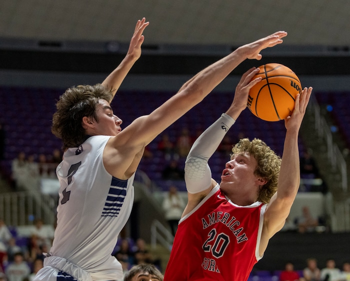 (Rick Egan | The Salt Lake Tribune) The Corner Canyon Chargers Isaac Neibaur blocks a shot by Ashton Wallace in their win over the American Fork Cavemen, for  the Boys 6A State Championship at Weber State, on Saturday, March 4, 2023.