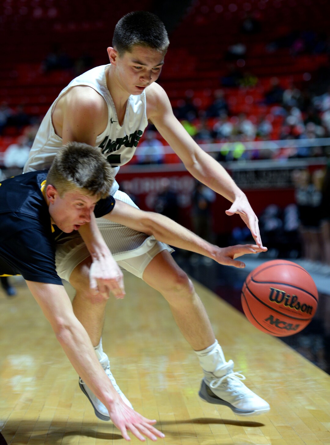 Steve Griffin  |  The Salt Lake TribuneWasatch guard Elias Ballstaedt dives and knocks the ball away form Olympus guard Rylan Jones during 4A playoff game at the Huntsman Center in Salt Lake City Tuesday February 28, 2017.