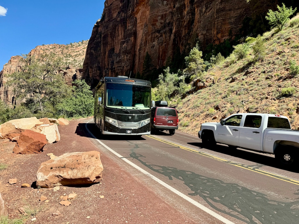 (Mark Eddington | The Salt Lake Tribune) A motor home drives along a road in Zion National Park, Tuesday, June 4, 2024. The park will prohibit large buses and motor homes starting in 2026.