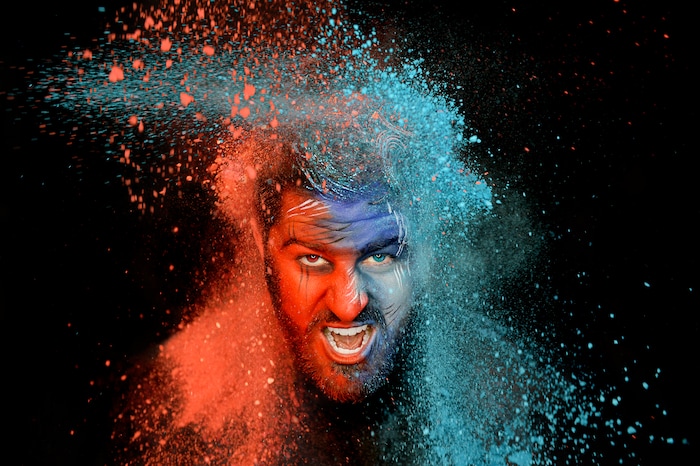 (Francisco Kjolseth | The Salt Lake Tribune) BYU and Utah fan alike Brad Klekas of South Jordan shows his mutual admiration by stepping into the Tribune studio to don both colors in anticipation of the upcoming match up between the two rival teams on Saturday.