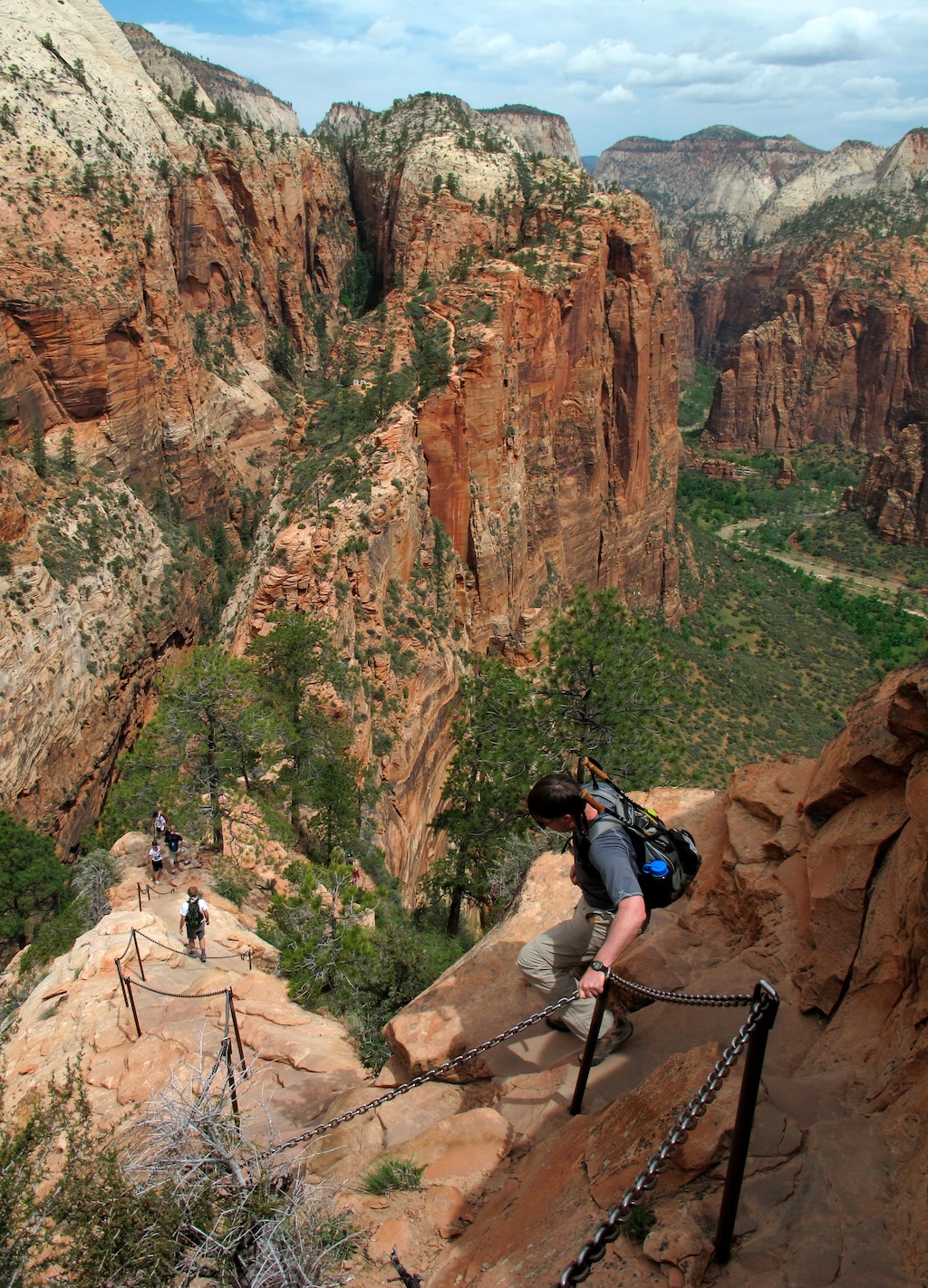 FILE - In this May 8, 2011, file photo, hikers climb down the Angels Landing trail in Zion National Park, in Utah. Zion National Park officials say a 13-year-old girl has fallen to her death from a popular narrow trail bordered by steep drops. (Jud Burkett /The Spectrum & Daily News via AP, File)
