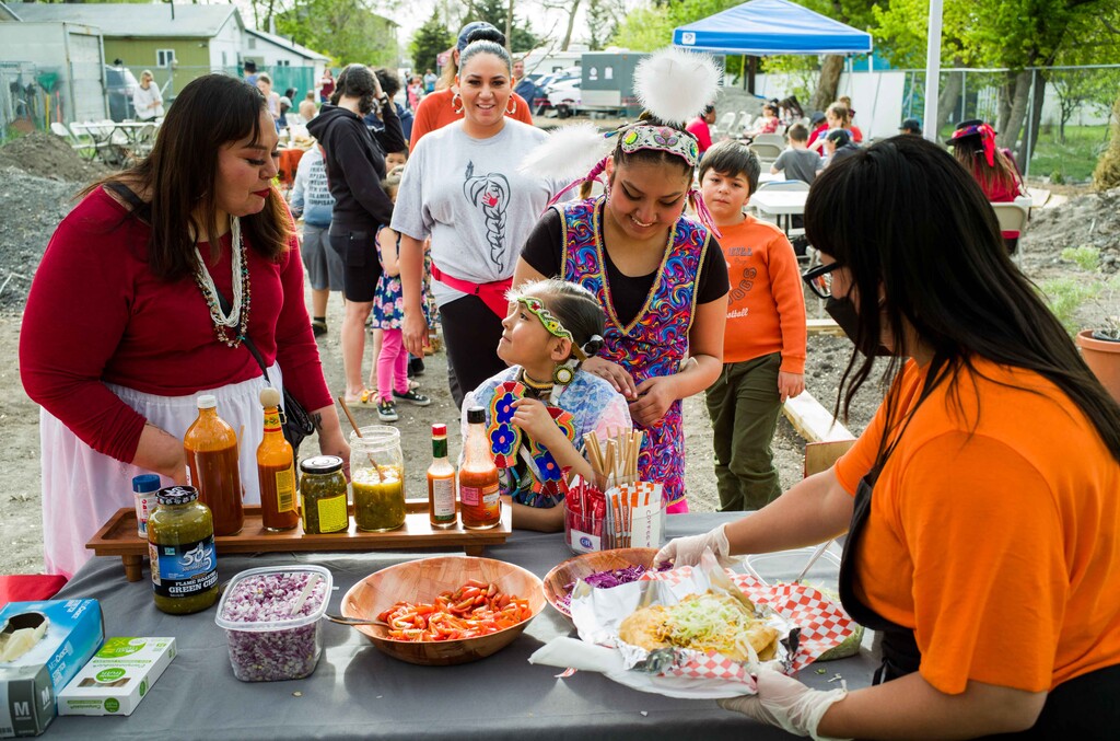 (Russel A. Daniels) People wait in line for Navajo tacos on May 5, 2022, at the Carry the Water Garden in Salt Lake City's Glendale neighborhood, during an event for Missing and Murdered Indigenous Women's Day.