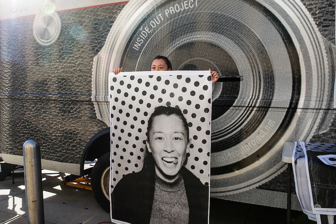 (Chris Detrick  |  The Salt Lake Tribune)  Jasmin Xanthos, of Salt Lake City, holds her portrait from the photo truck during the Inside Out/Dreamers Project at the Salt Lake City Public Library Tuesday, November 21, 2017.  The Inside Out Project is a global participatory art project that gives everyone the opportunity to share their portrait and express what they stand for. In Utah, the future of more than 10,500 DACA recipients is being threatened by President Trump's decision to end the popular and successful DACA program.