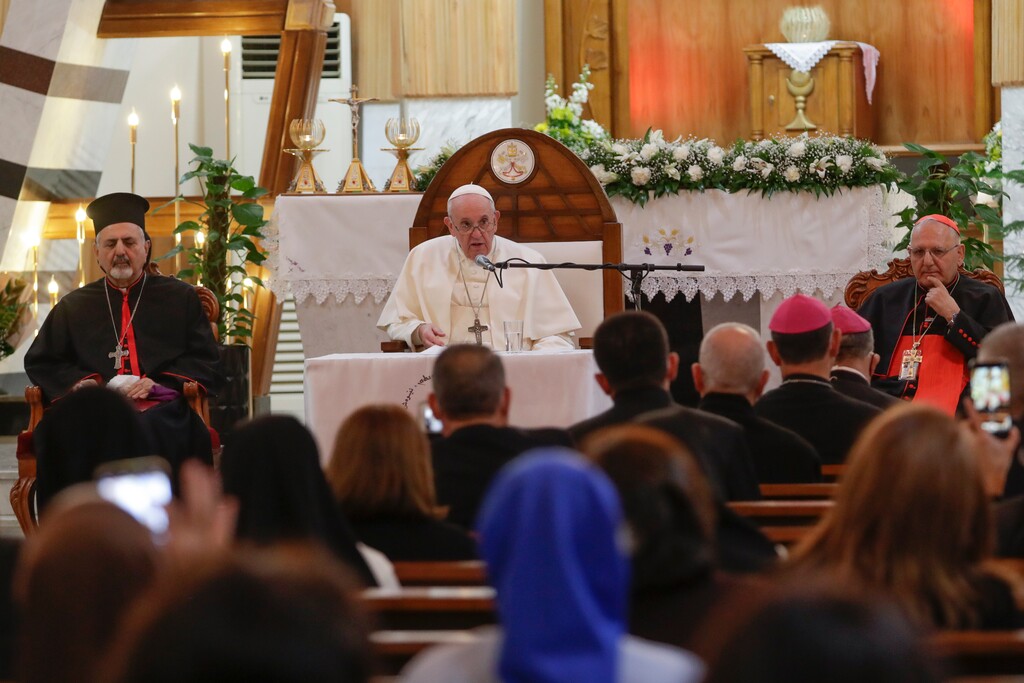 (Andrew Medichini | AP) Syriac Catholic Patriarch of Antioch Ignatius Ephrem Joseph III Yonan, left, and Patriarch of Babylon of the Chaldeans Cardinal Louis Sako, right, listen to Pope Francis delivering his speech during a meeting with bishops and priests, at the Sayidat al-Nejat (Our Lady of Salvation) Cathedral, in Baghdad, Iraq, Friday, March 5, 2021. Pope Francis has arrived in Iraq to urge the country's dwindling number of Christians to stay put and help rebuild the country after years of war and persecution, brushing aside the coronavirus pandemic and security concerns.