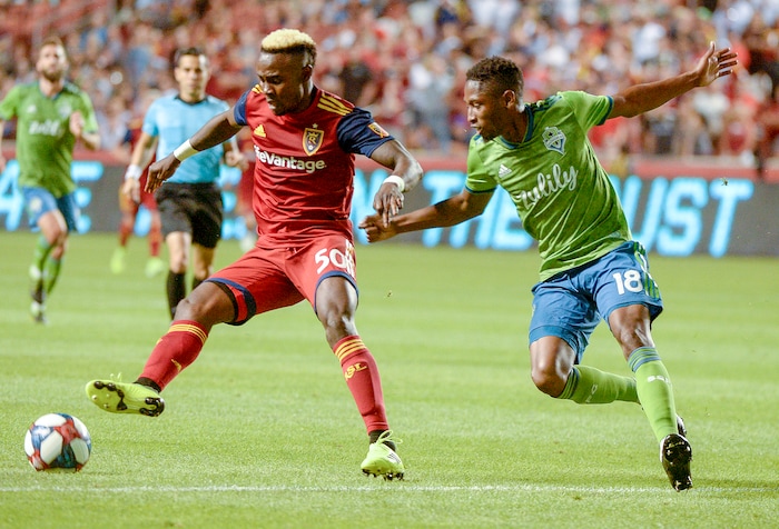 (Leah Hogsten  |  The Salt Lake Tribune) Real Salt Lake forward Sam Johnson (50) battles Seattle Sounders defender Kelvin Leerdam (18) as Real Salt Lake hosts the Seattle Sounders, Aug. 14, 2019, at Rio Tinto Stadium in Sandy.