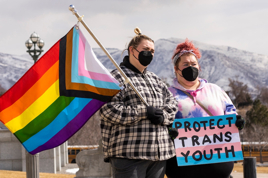(Rick Egan | The Salt Lake Tribune)   Rachel and Kati join more than 200 people on the steps of the Capitol for a rally, speaking out against Rep. Kera Birkeland's transgender sports bill, on Friday, Feb. 25, 2022.