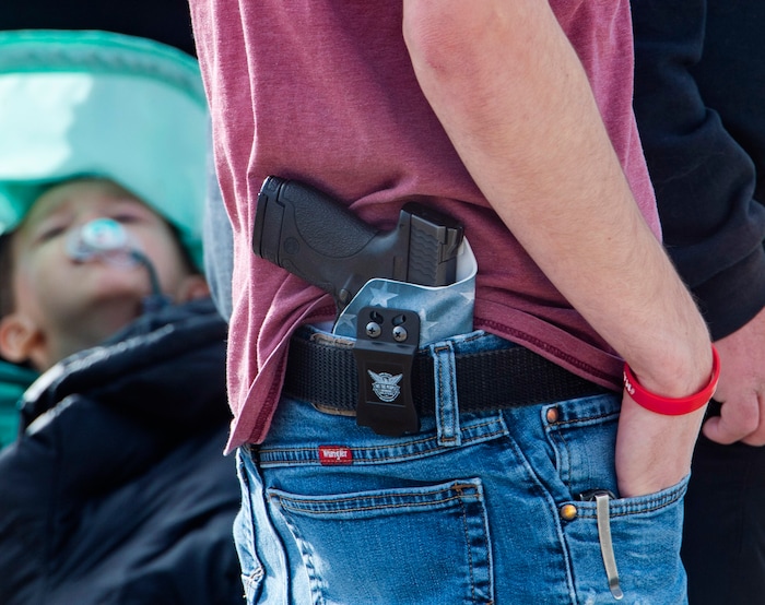 (Rick Egan | The Salt Lake Tribune) One of about a dozen protesters showed up at the Utah Capitol, on Sunday, Jan. 17, 2021.