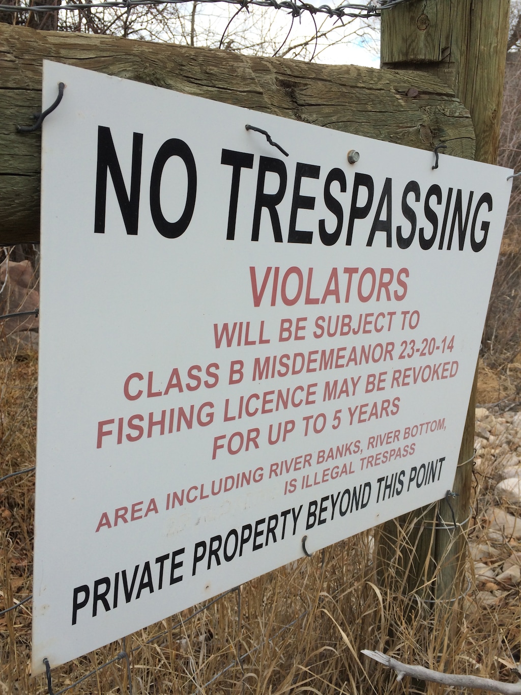 Courtesy | Utah Stream Access Coalition
A signed posted on the upper Weber River warns anglers they could be cited for trespassing and lose fishing privileges if they fish on private property. The sign has been modified to remove the words Òor floatingÓ from the list of prohibited activities. Two lawsuits brought by stream access advocates are attacking a controversial Utah law that greatly limit public access to rivers that flow through private property. Floating such waters, including the Weber, remains legal as long as the boater does not stop or touch the stream bed.