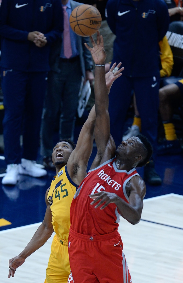 (Francisco Kjolseth | The Salt Lake Tribune) Utah Jazz guard Donovan Mitchell (45) comes up short in a jump ball with Houston Rockets center Clint Capela (15) in the final minutes of Game 4 of the NBA playoffs at the Vivint Smart Home Arena Sunday, May 6, 2018 in Salt Lake City. Houston took a 3-1 series lead over the Jazz with a final score of 100 to 87.
