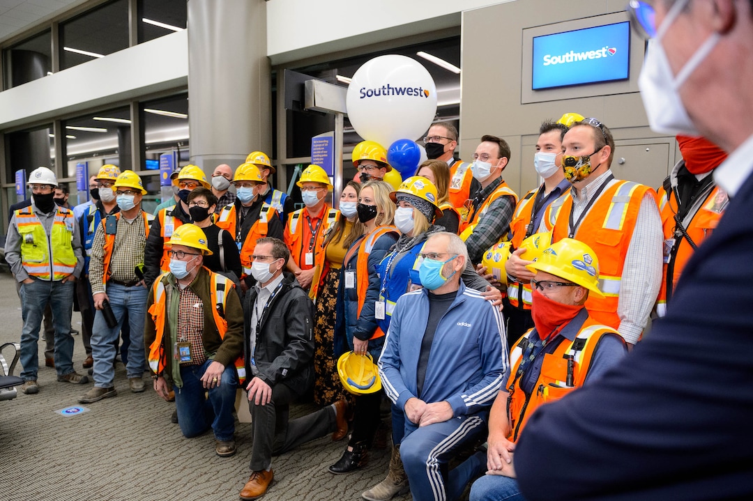 (Trent Nelson  |  The Salt Lake Tribune) Workers pose for a photo as the Salt Lake City International Airport celebrates the opening of concourse B, with a Southwest flight to Oakland taking off on Tuesday, Oct. 27, 2020.